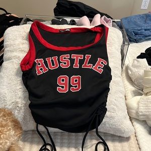 Red and black “hustle” crop top. Worn once